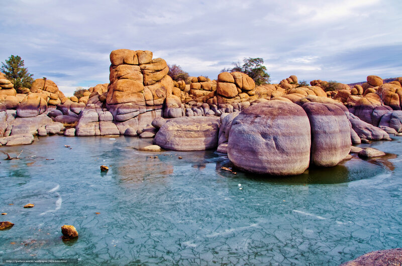 Frozen river with rock formations