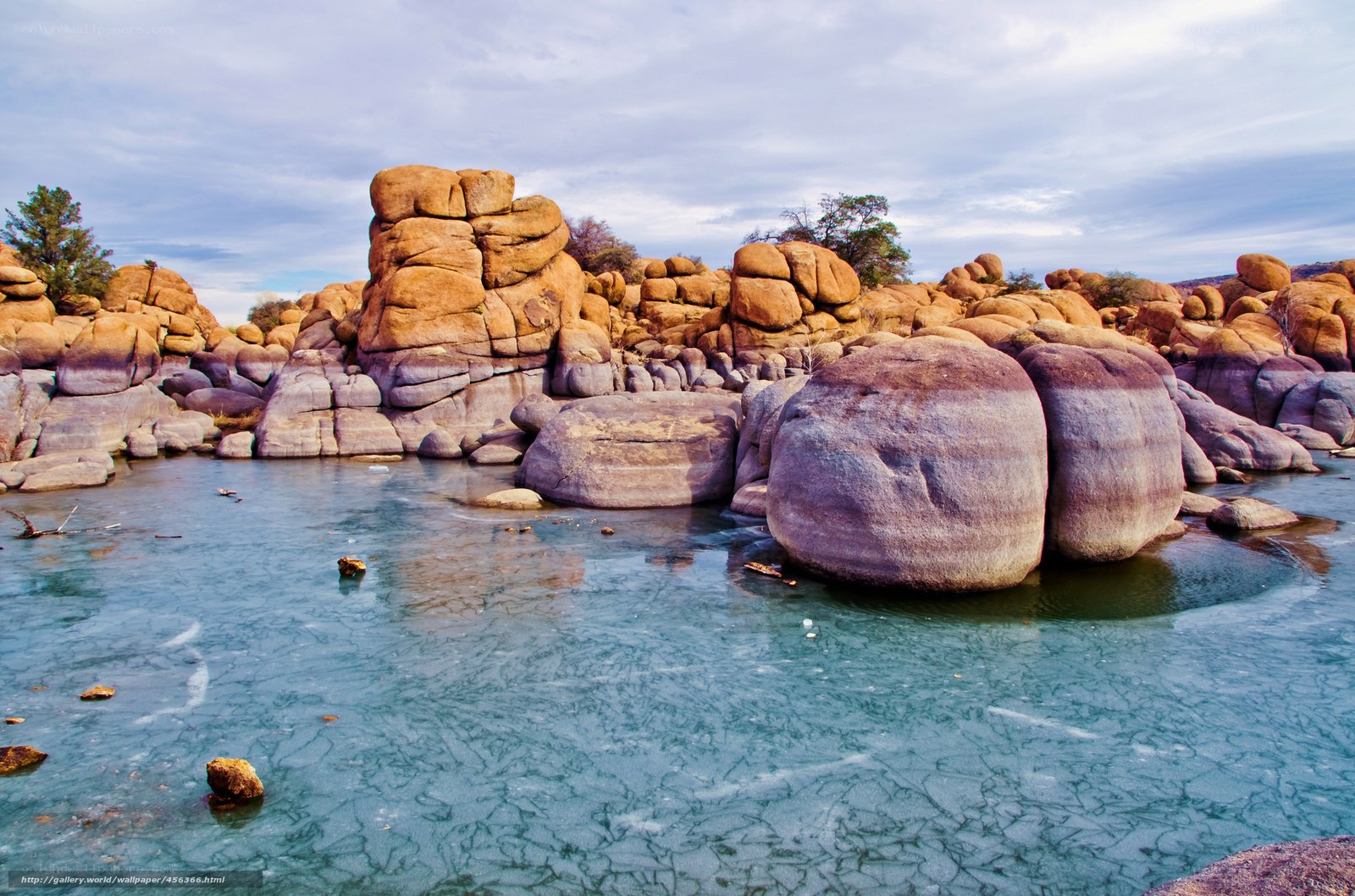 Frozen river with rock formations