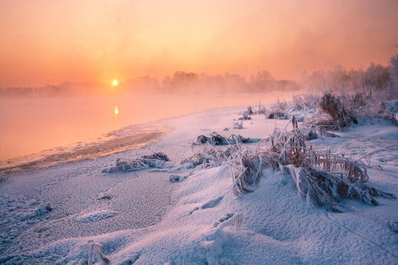 Frozen Riverbank at Sunrise