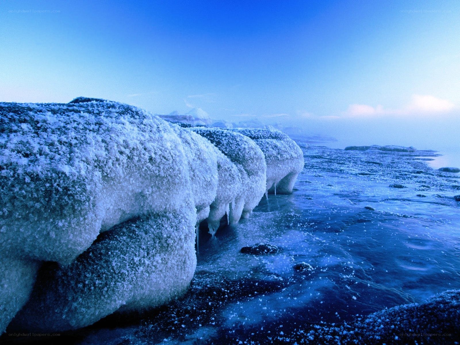 Frozen rocks on icy shore