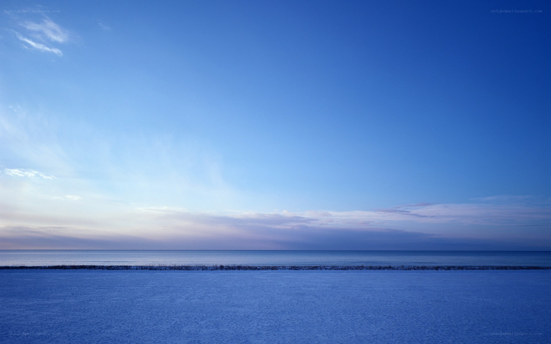 Frozen sea under clear sky