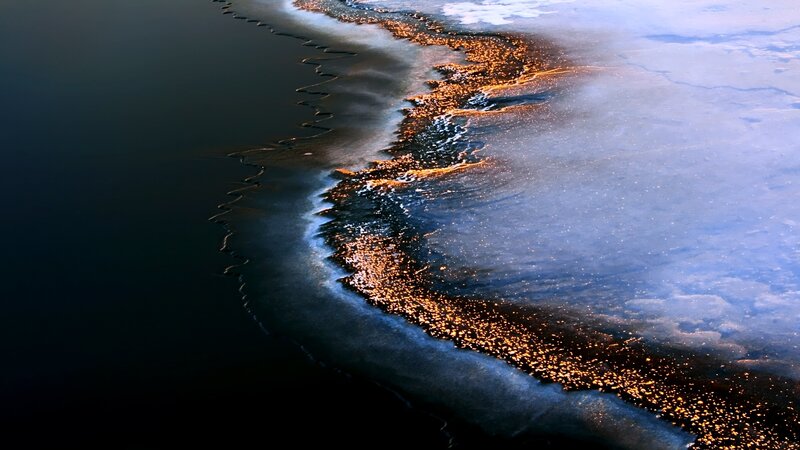 Frozen shoreline at dusk
