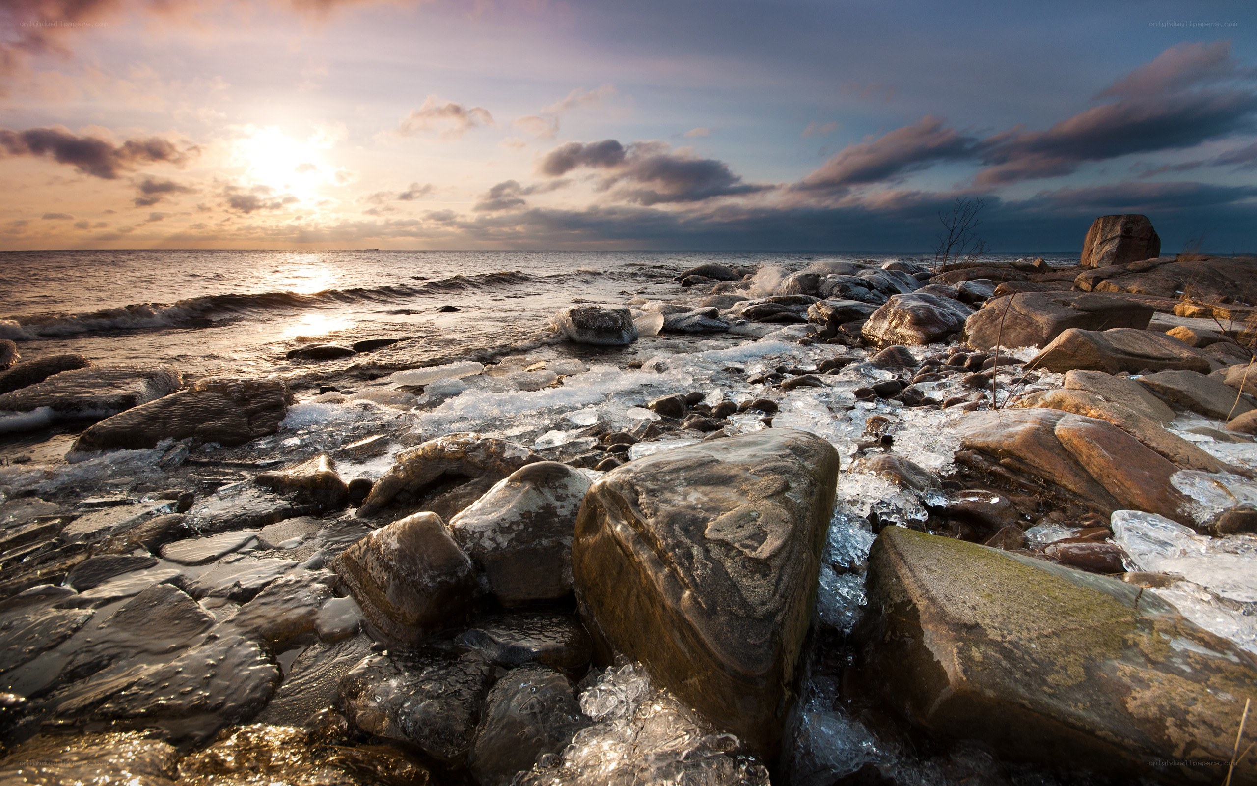 Frozen shoreline at sunset