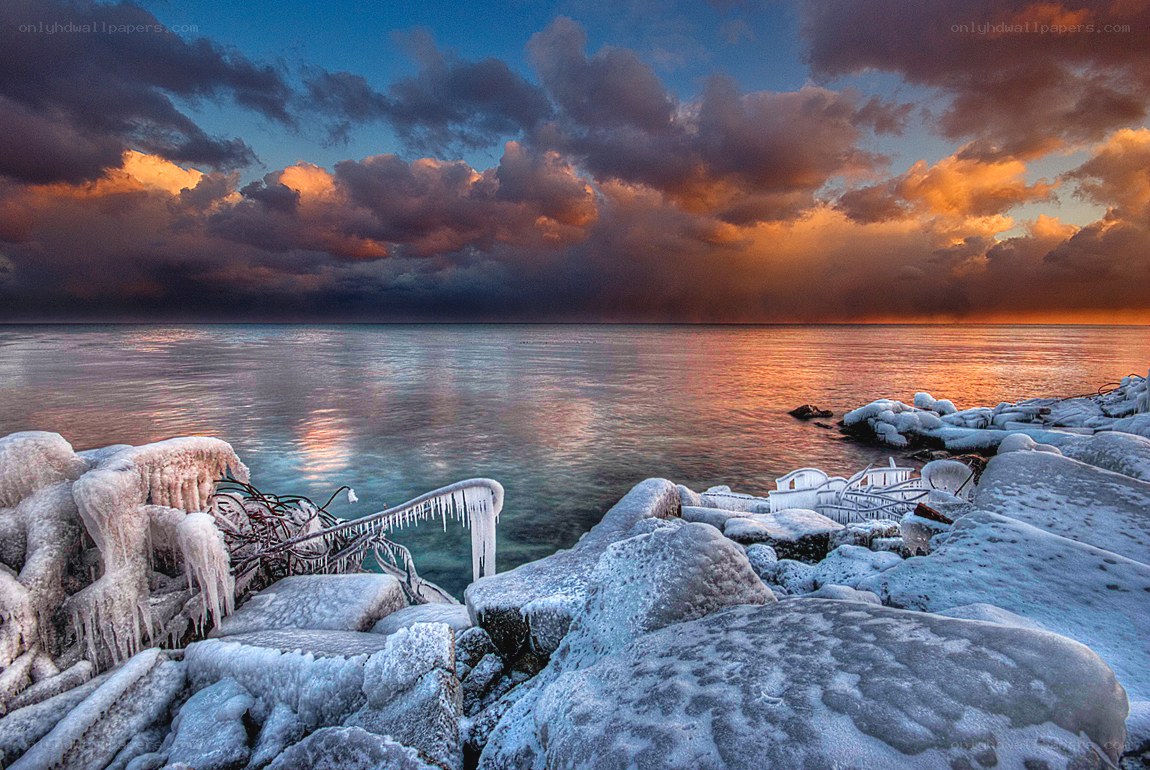Frozen shoreline at sunset