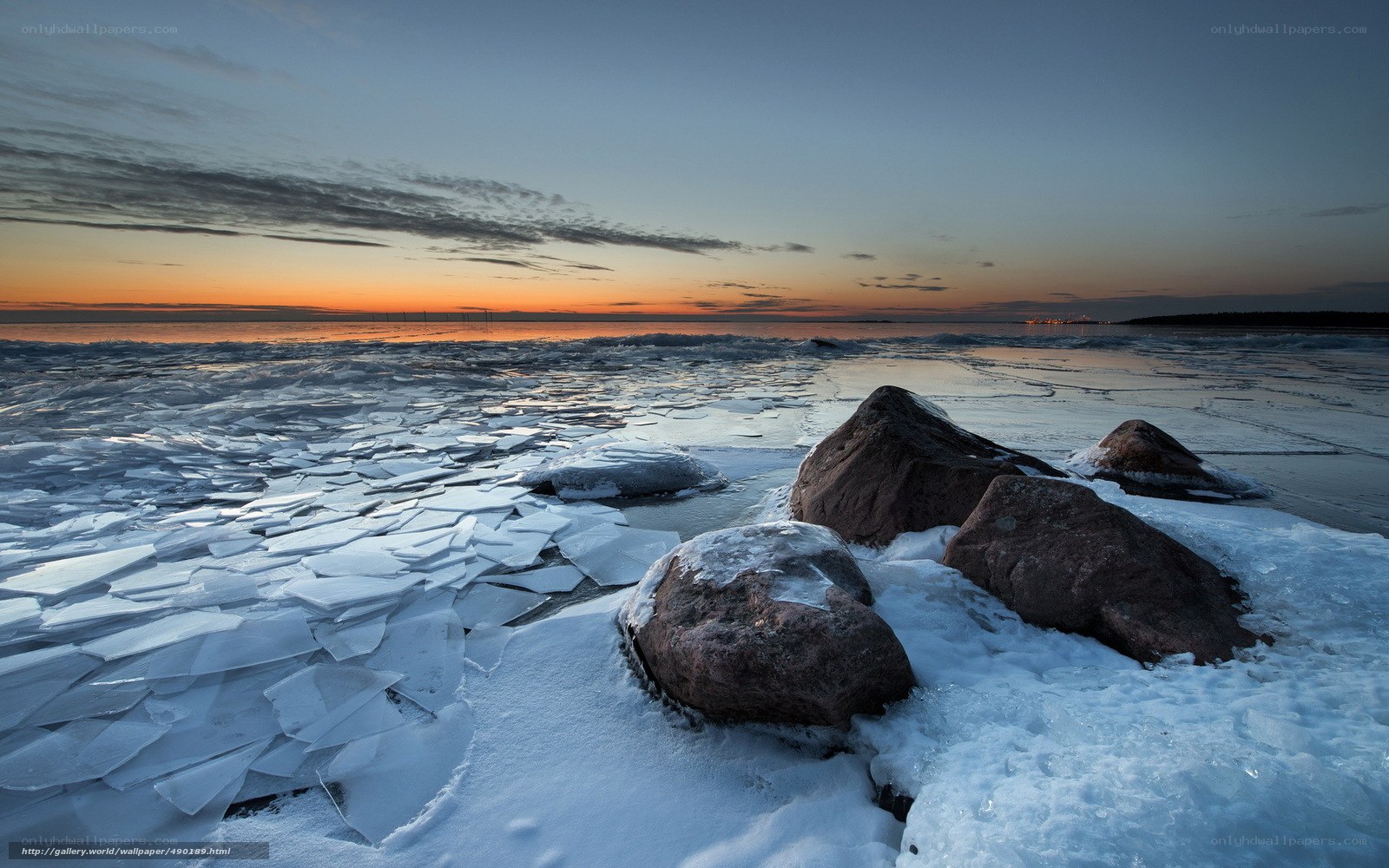 Frozen shoreline at sunset