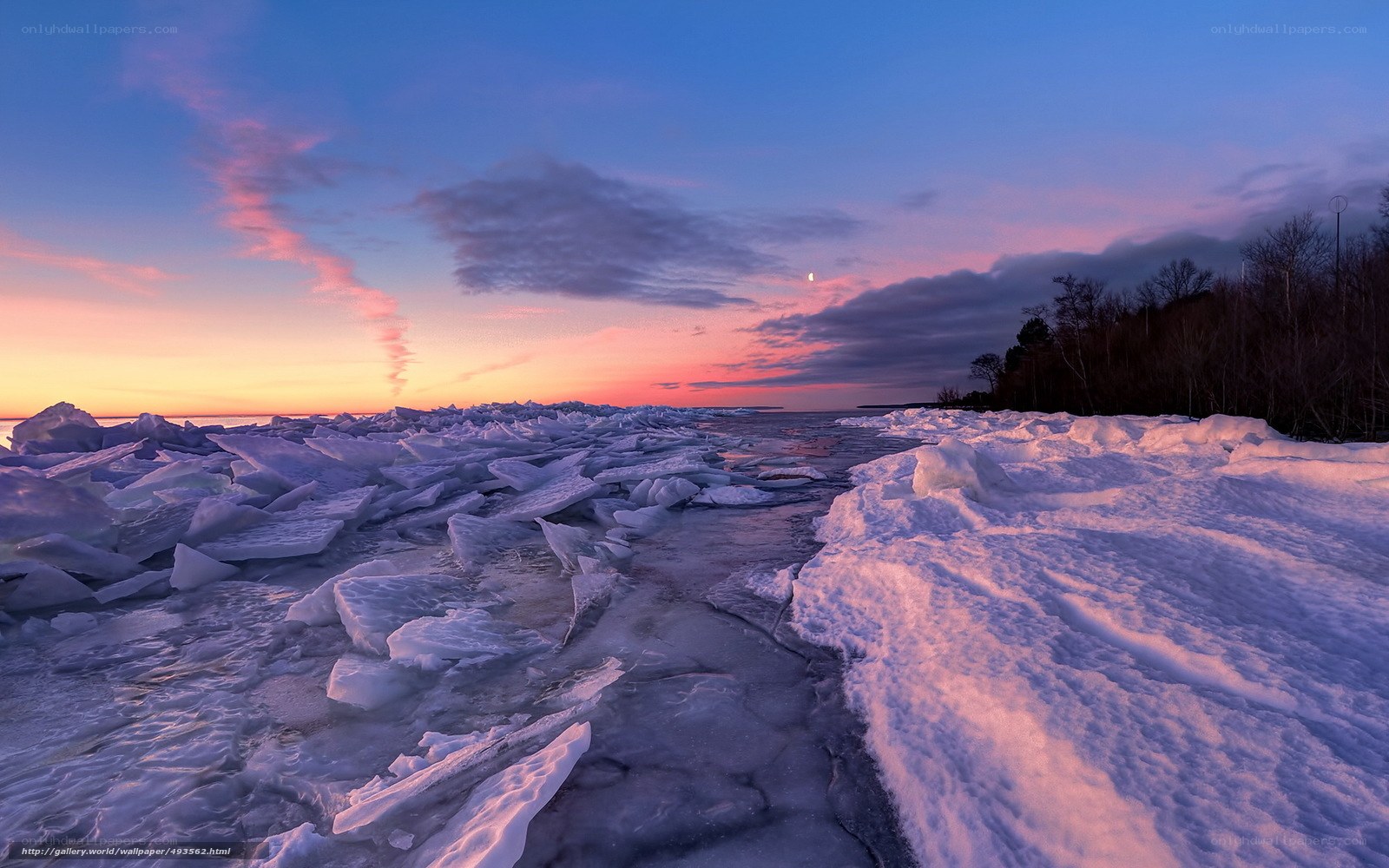 Frozen shoreline at sunset