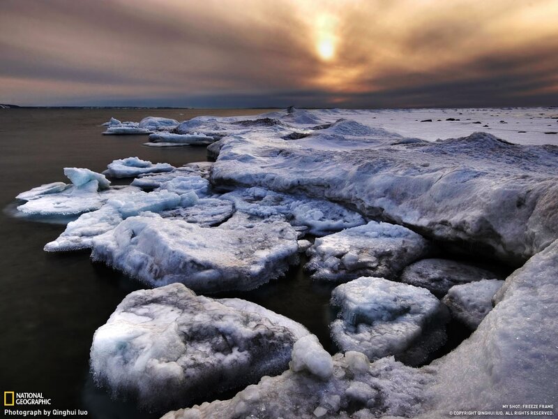 Frozen shoreline at sunset