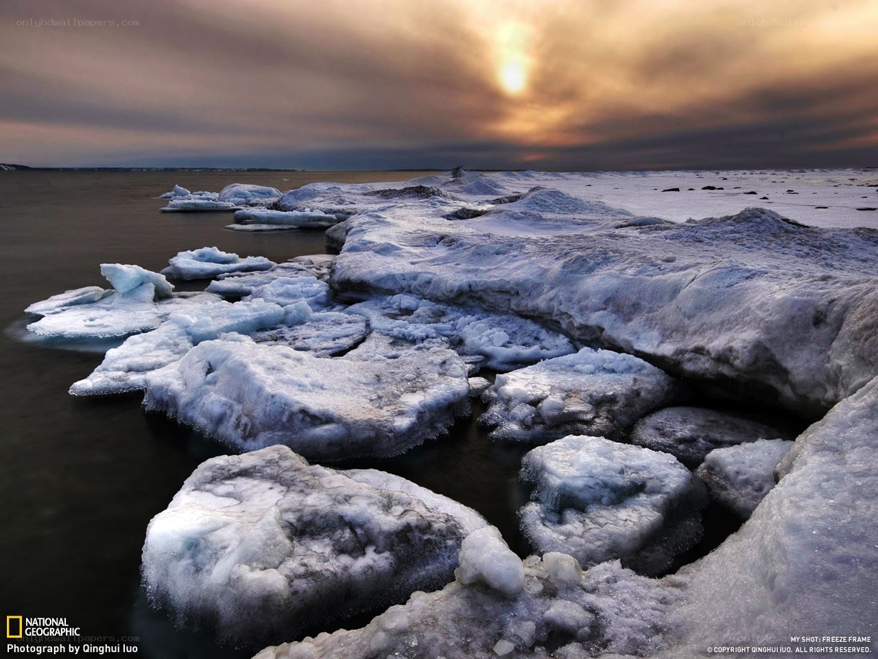 Frozen shoreline at sunset