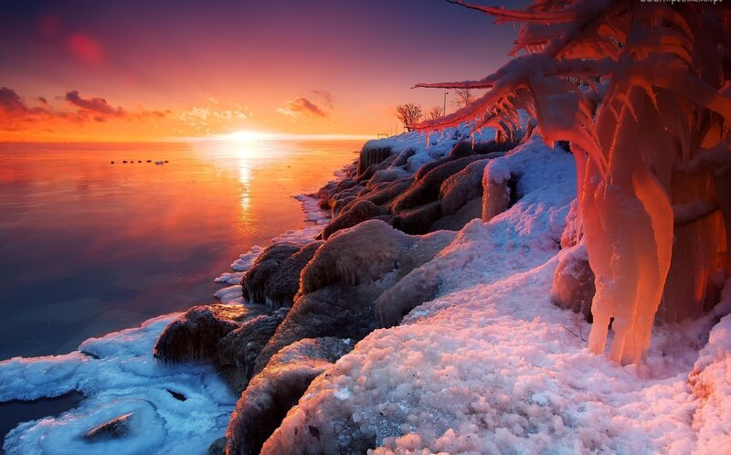 Frozen Shoreline at Sunset — Orange, Dramatic
