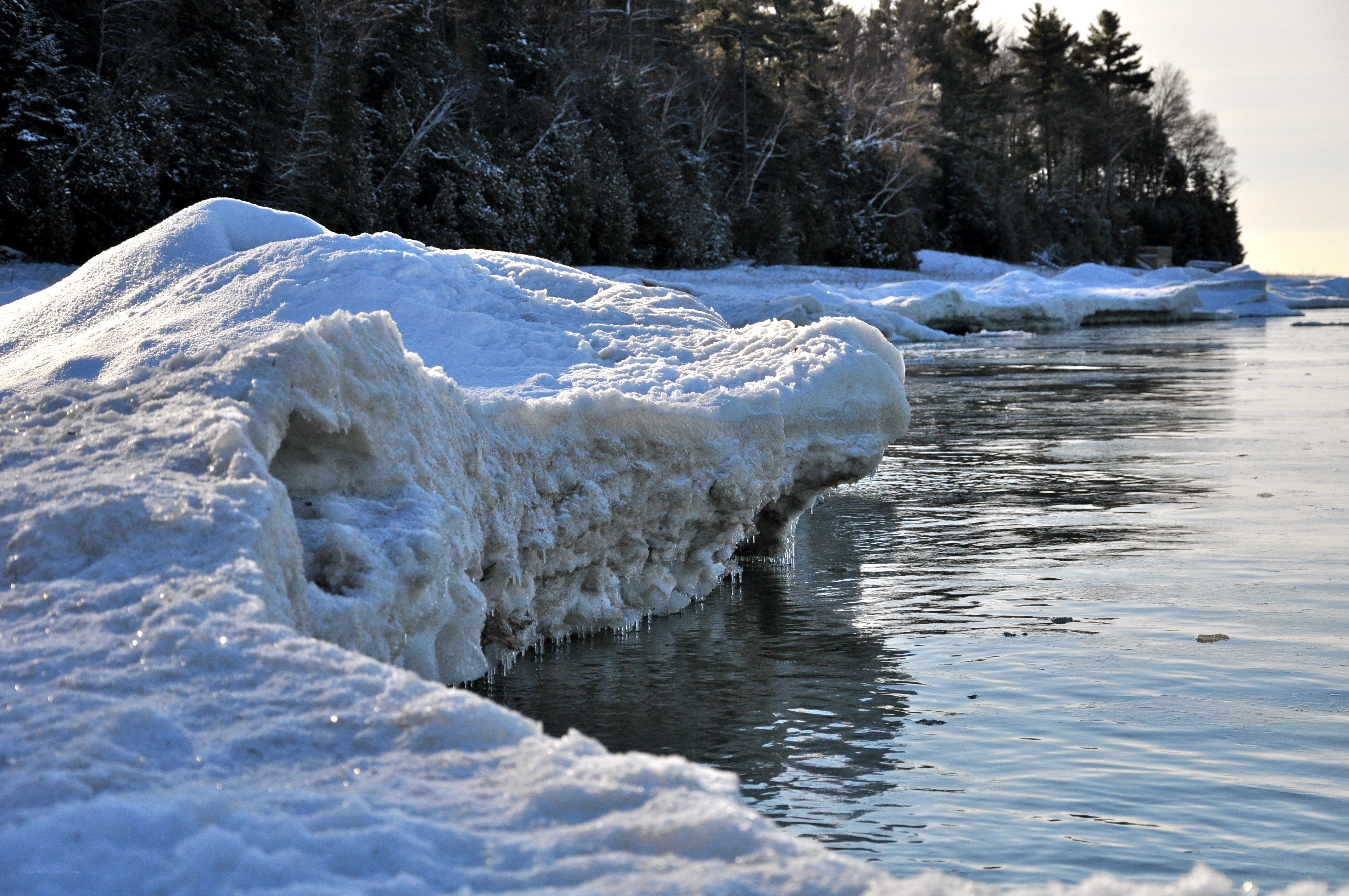 Frozen shoreline with ice formations