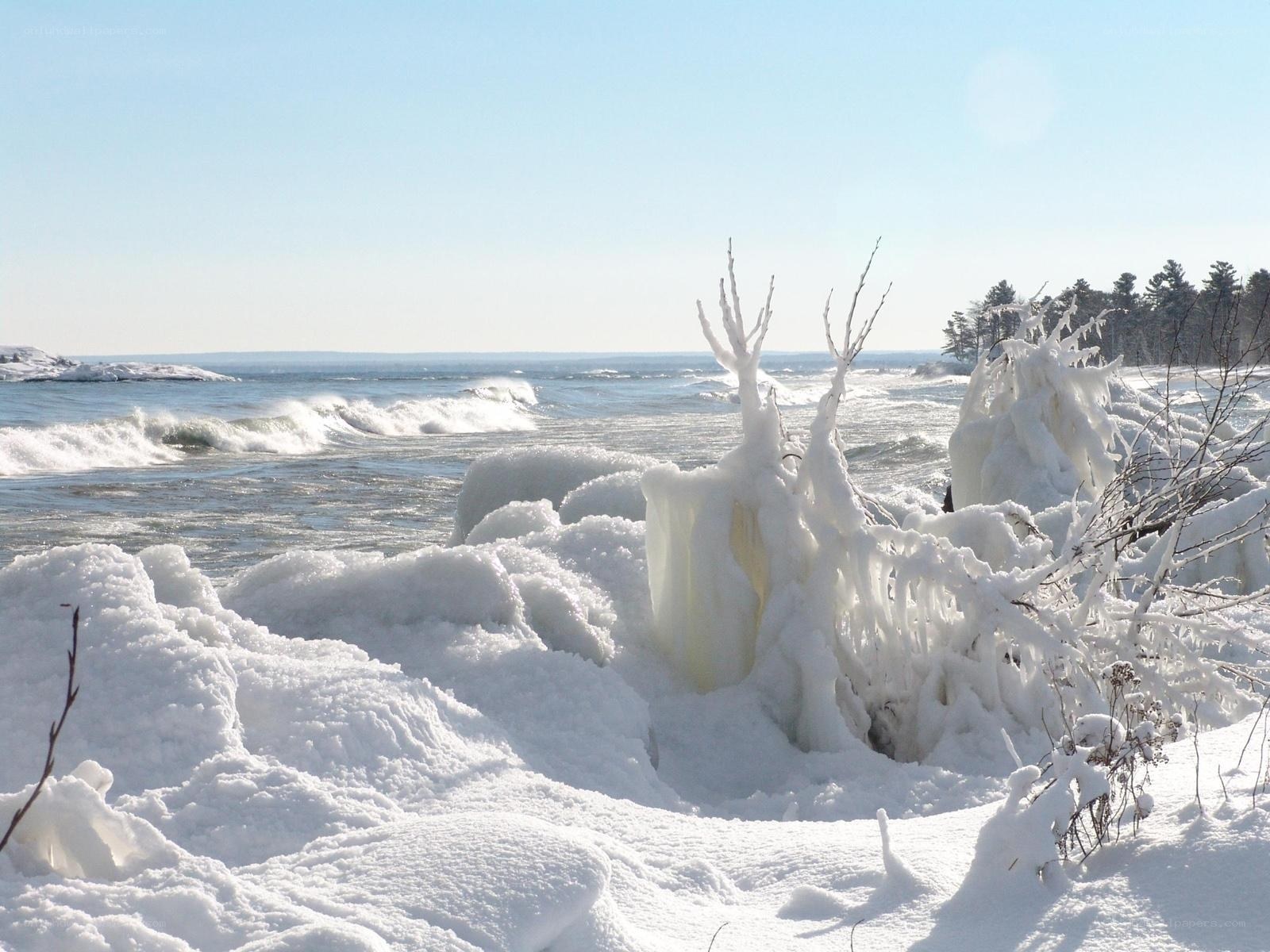 frozen shoreline with icy waves