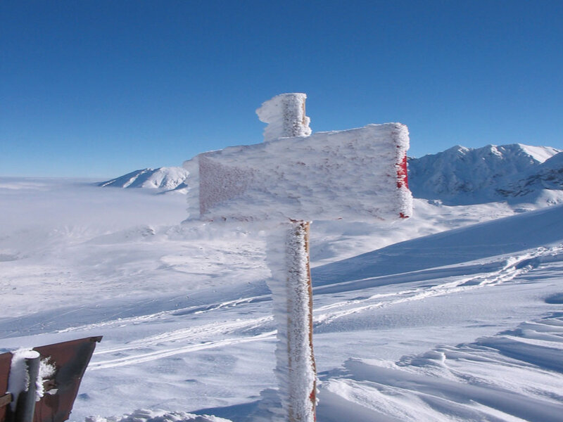 Frozen Signpost in Snow