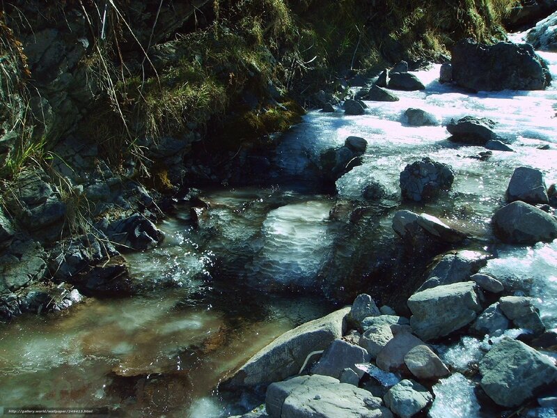Frozen stream in rocky terrain