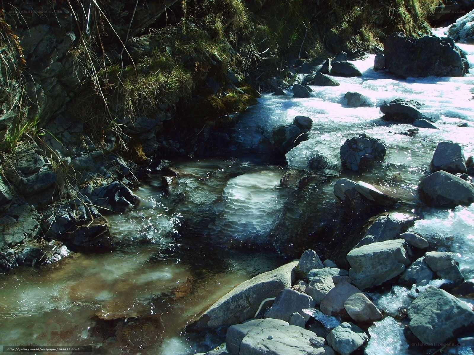 Frozen stream in rocky terrain
