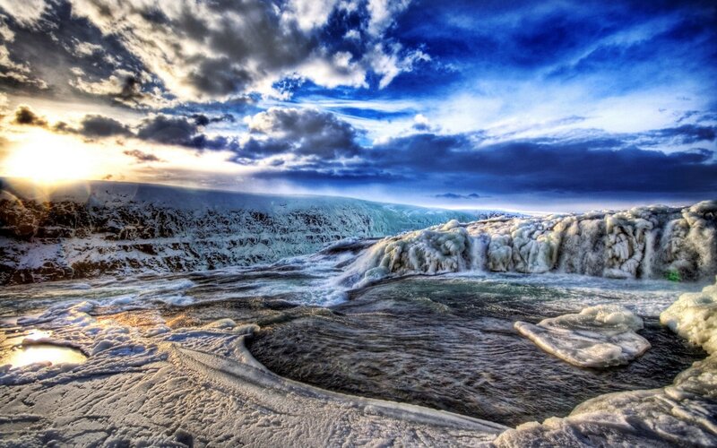 Frozen waterfall at sunset