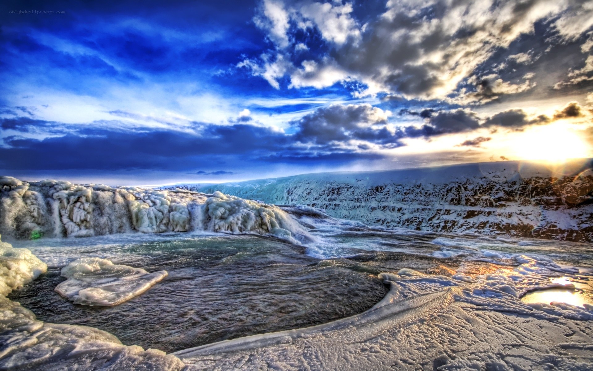 Frozen waterfall at sunset