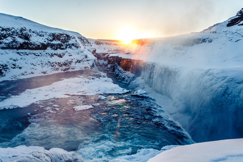 Frozen waterfall at sunset