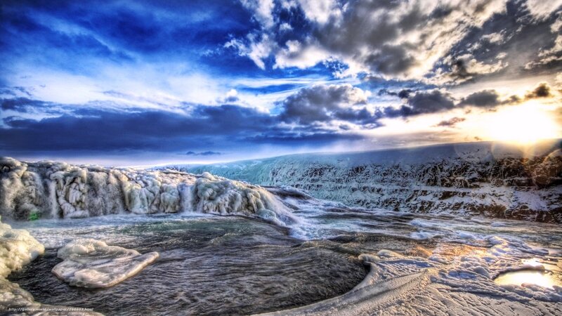 Frozen waterfall at sunset