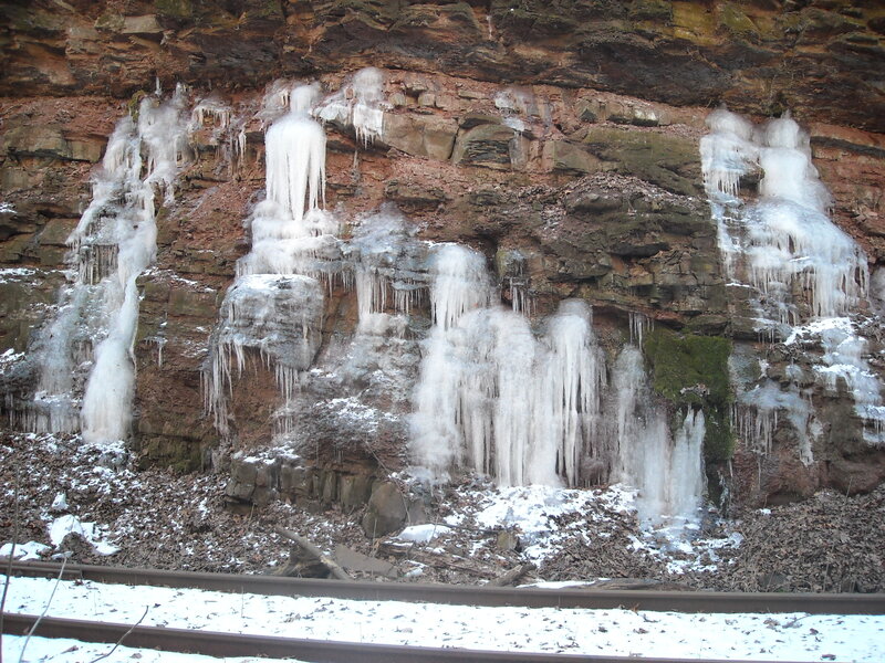 Frozen waterfall on cliff face