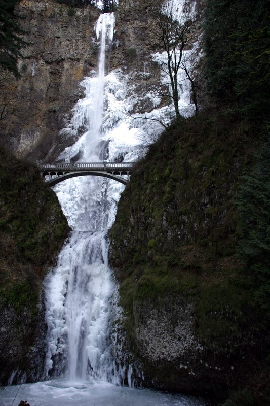 Frozen waterfall with bridge