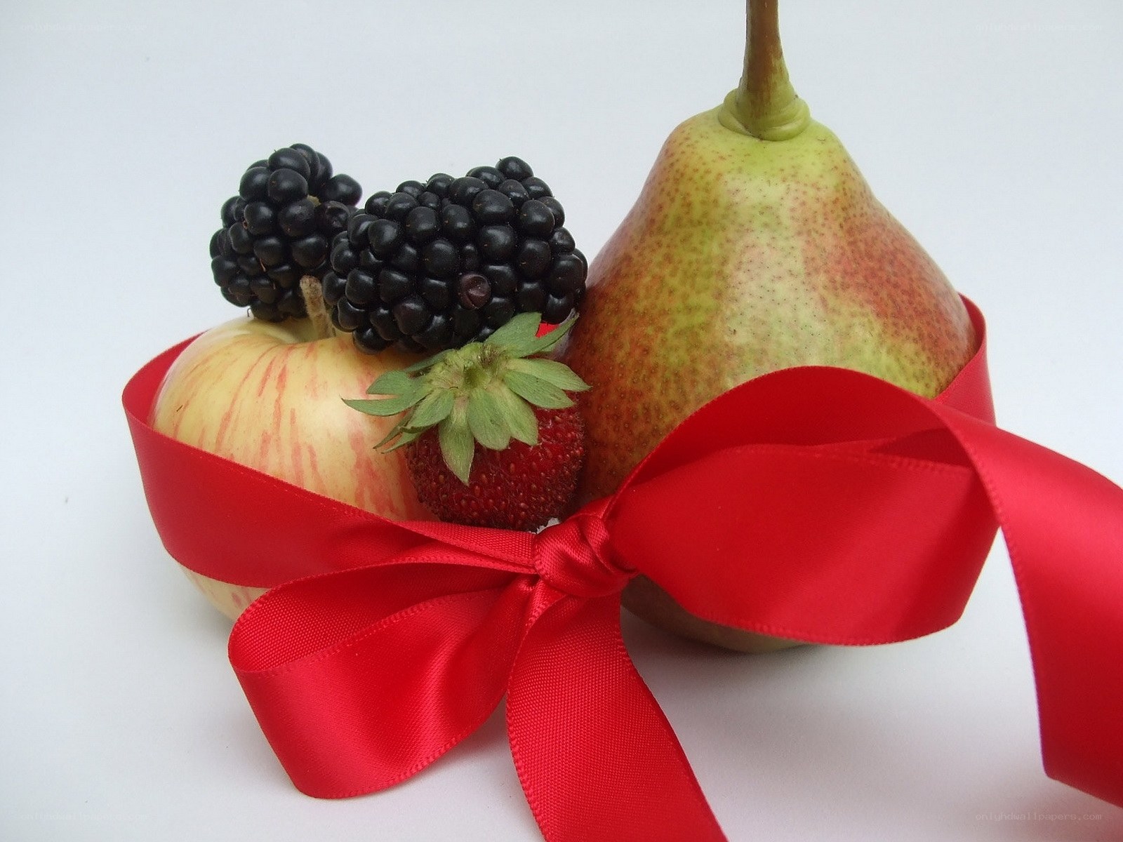 Fruit arrangement with red ribbon