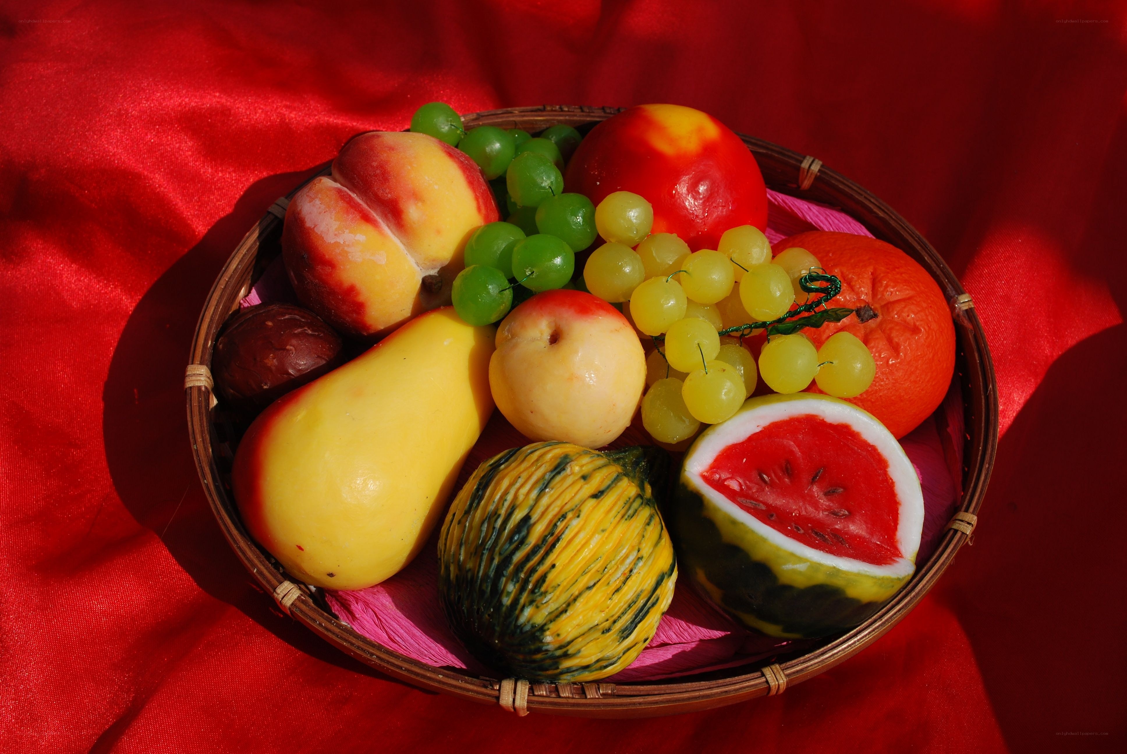 Fruit basket on red cloth