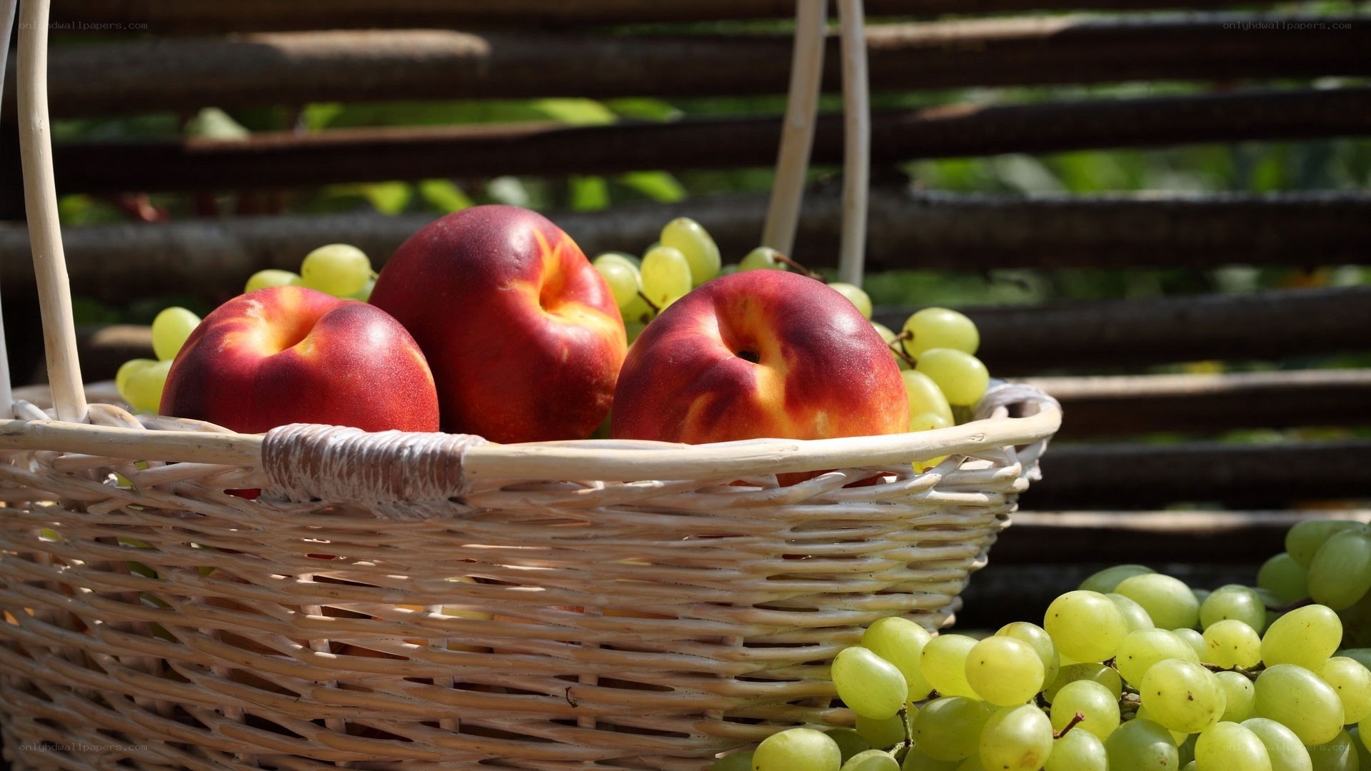 Fruit basket with peaches and grapes