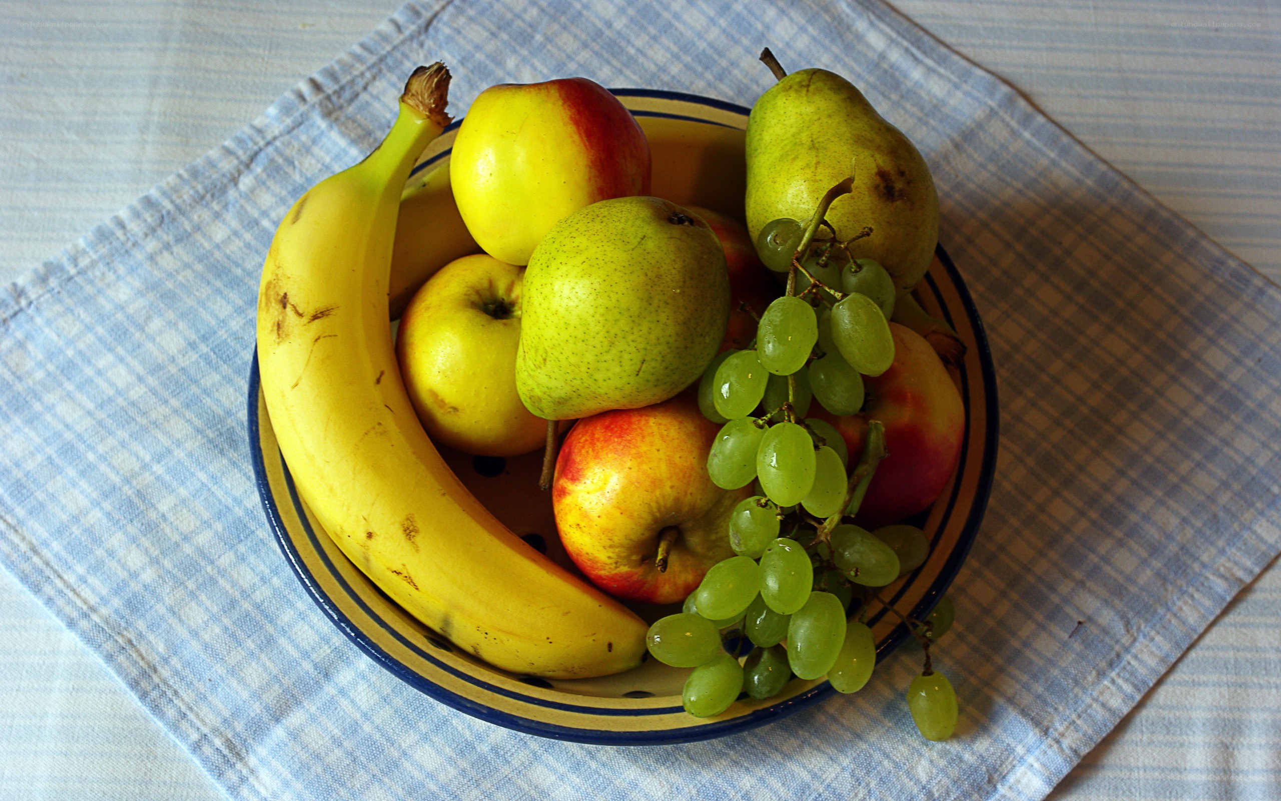 fruit bowl on checkered cloth