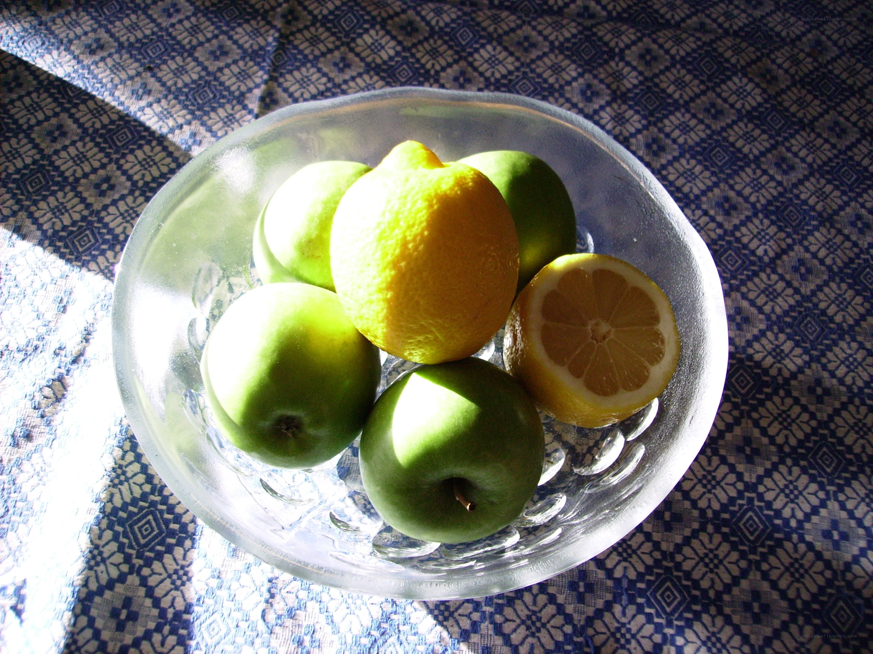 fruit bowl with lemons and apples