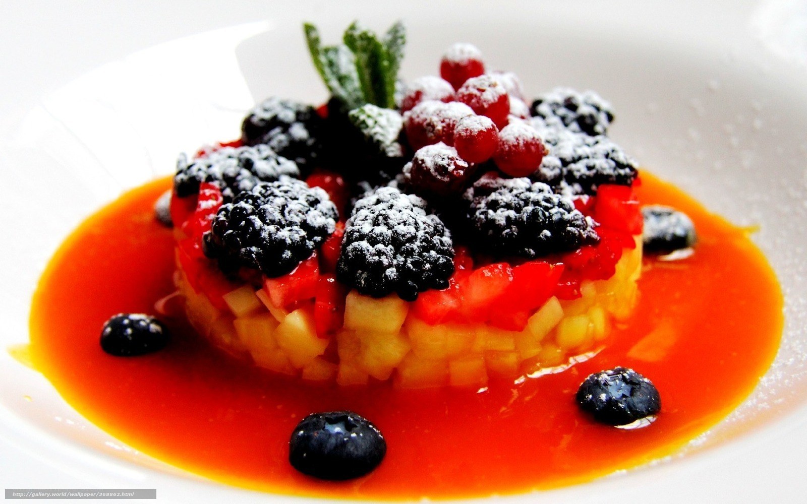 fruit dessert with berry sauce