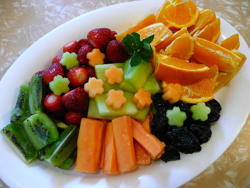 fruit platter with strawberries and oranges