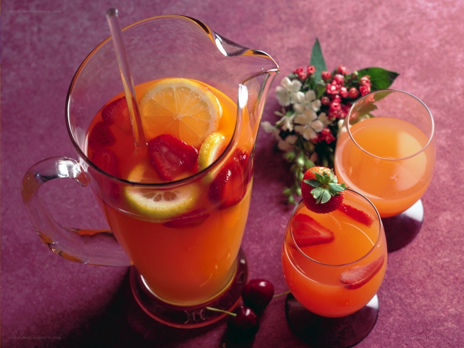 fruit punch in pitcher and glasses