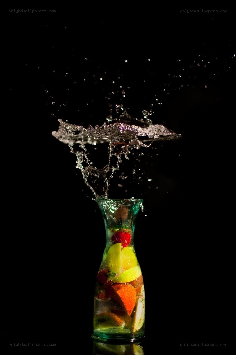 fruit splash in glass bottle
