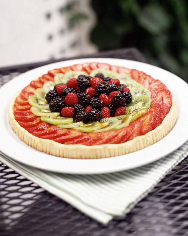 fruit tart on white plate