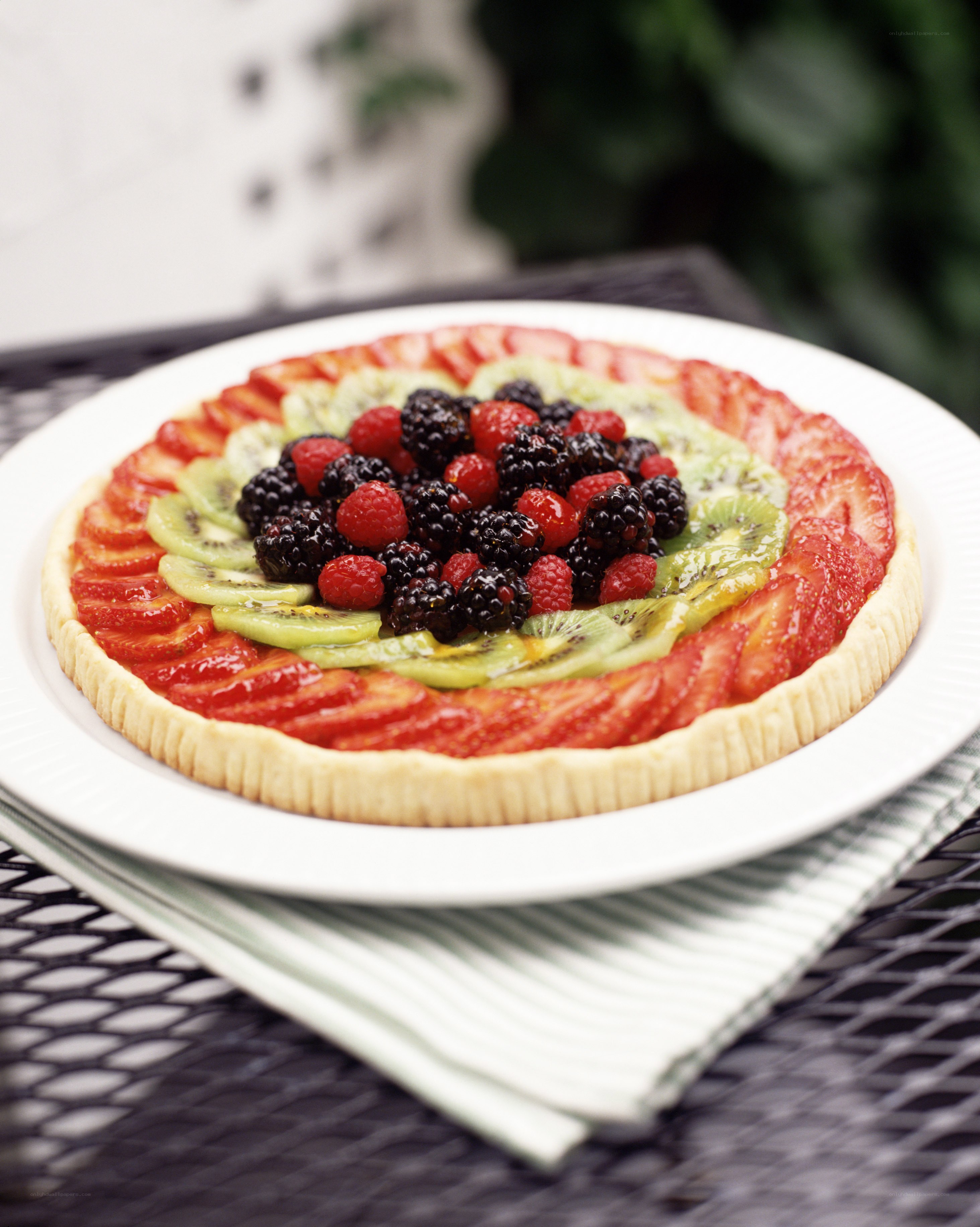 fruit tart on white plate