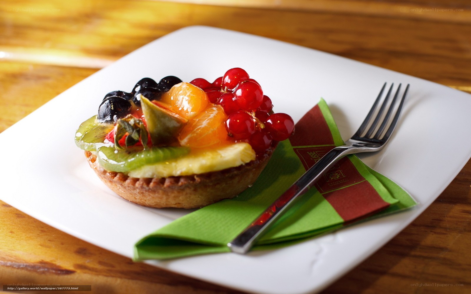 fruit tart on white plate