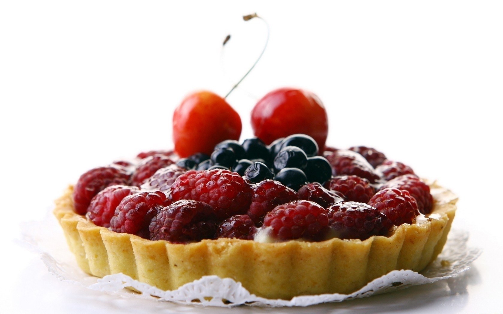 fruit tart with berries and cherries