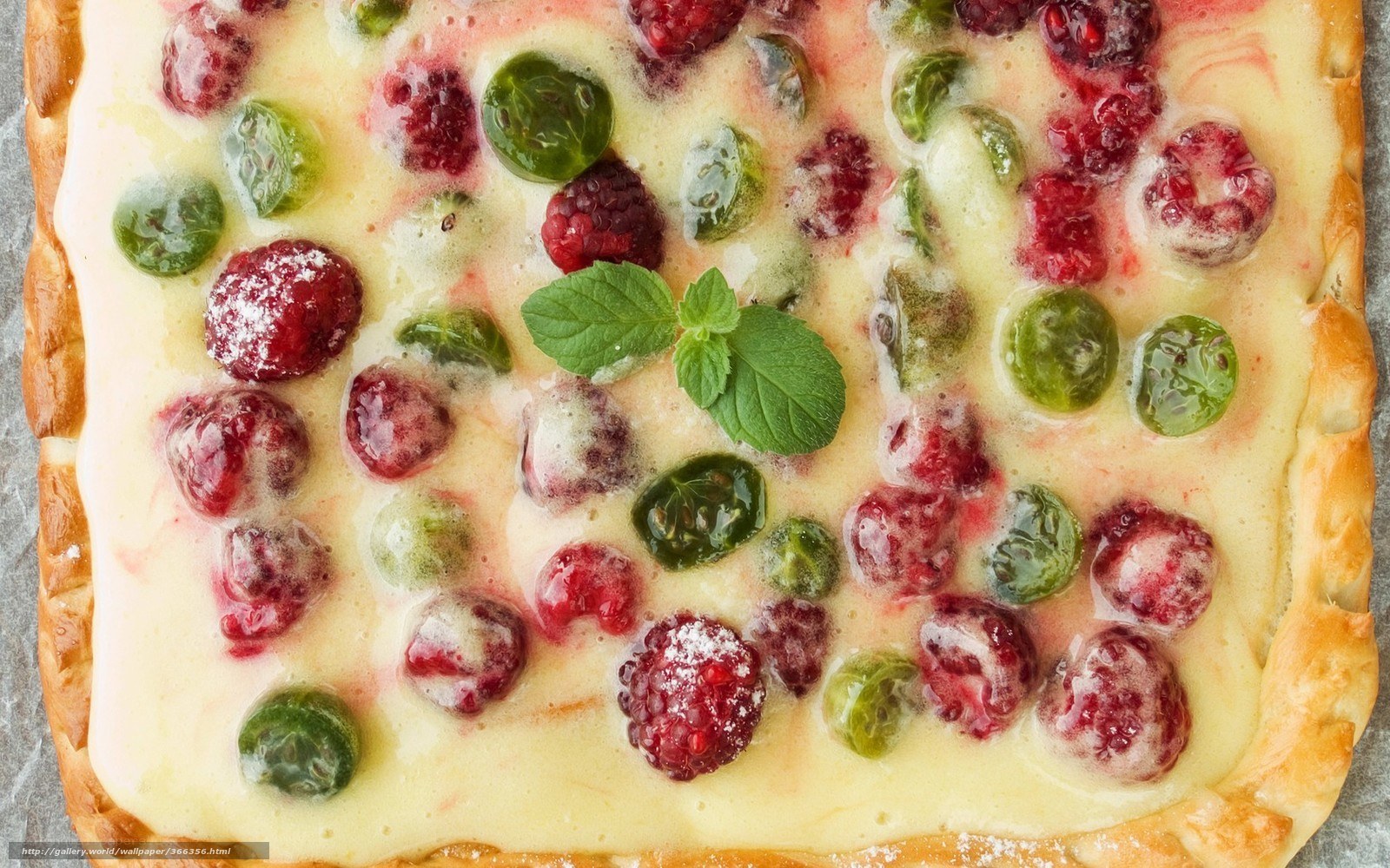 Fruit tart with berries and mint