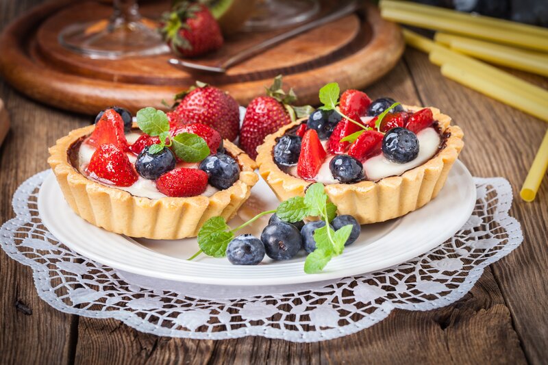 Fruit Tarts on Plate — Brown