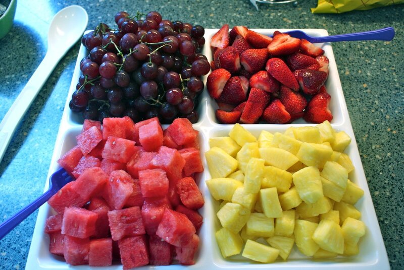 fruit tray with grapes strawberries watermelon pineapple