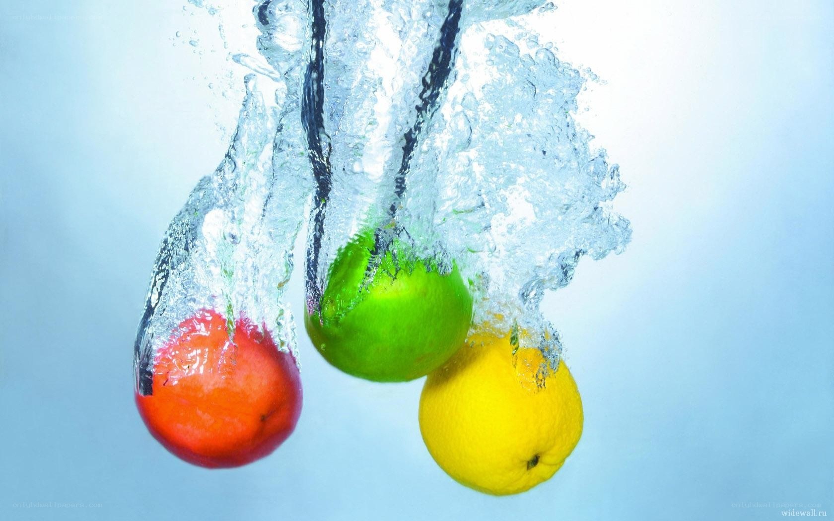 fruits splashing in water