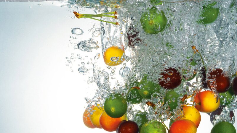 fruits splashing in water