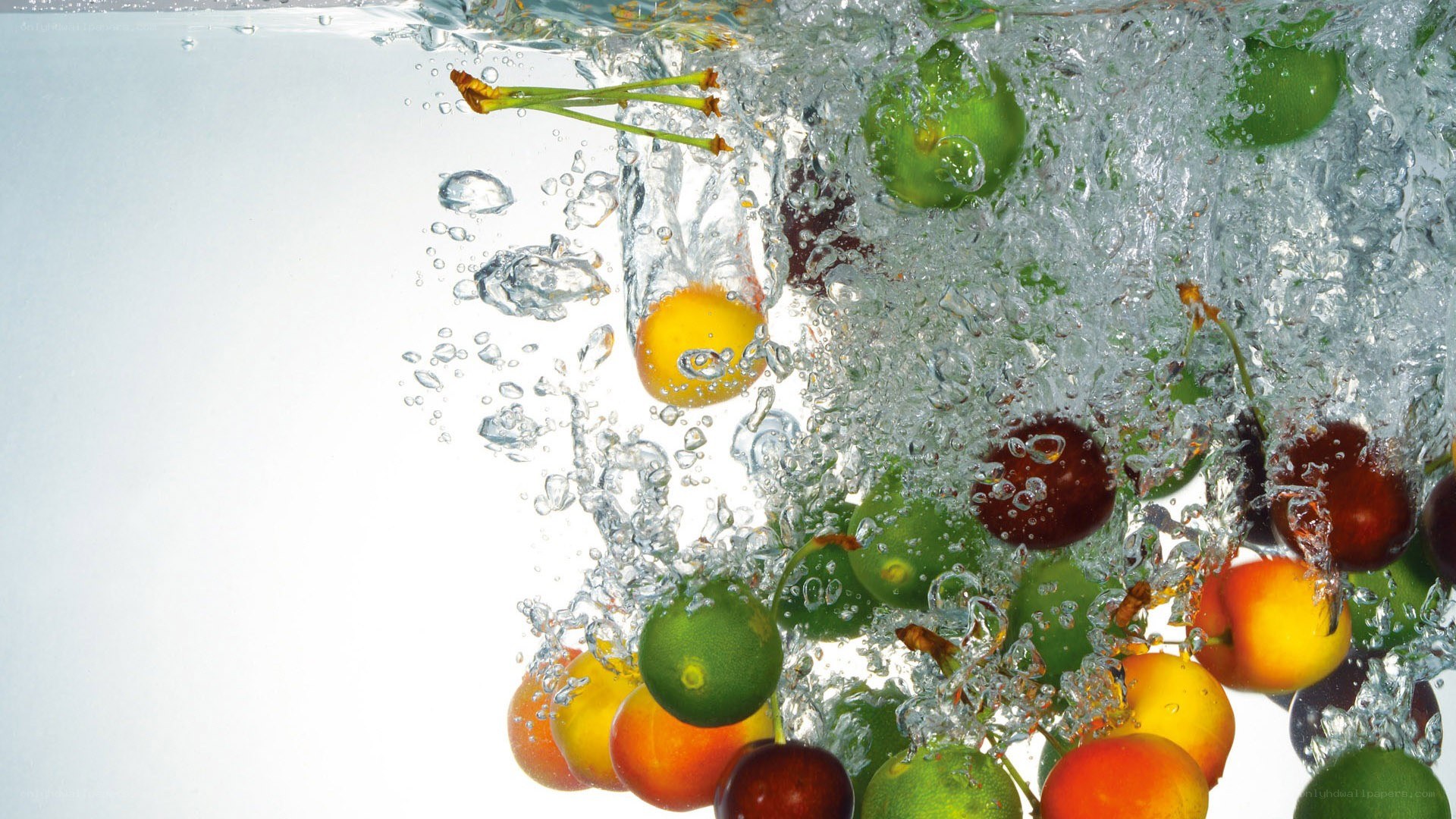 fruits splashing in water