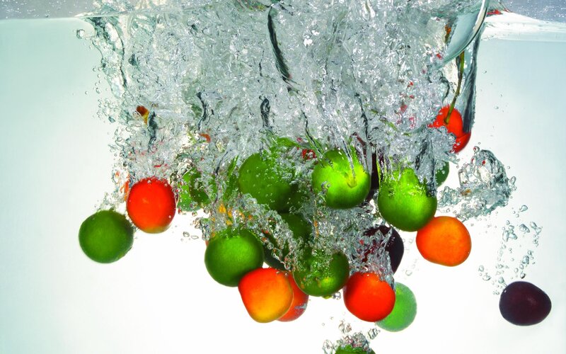 fruits splashing in water