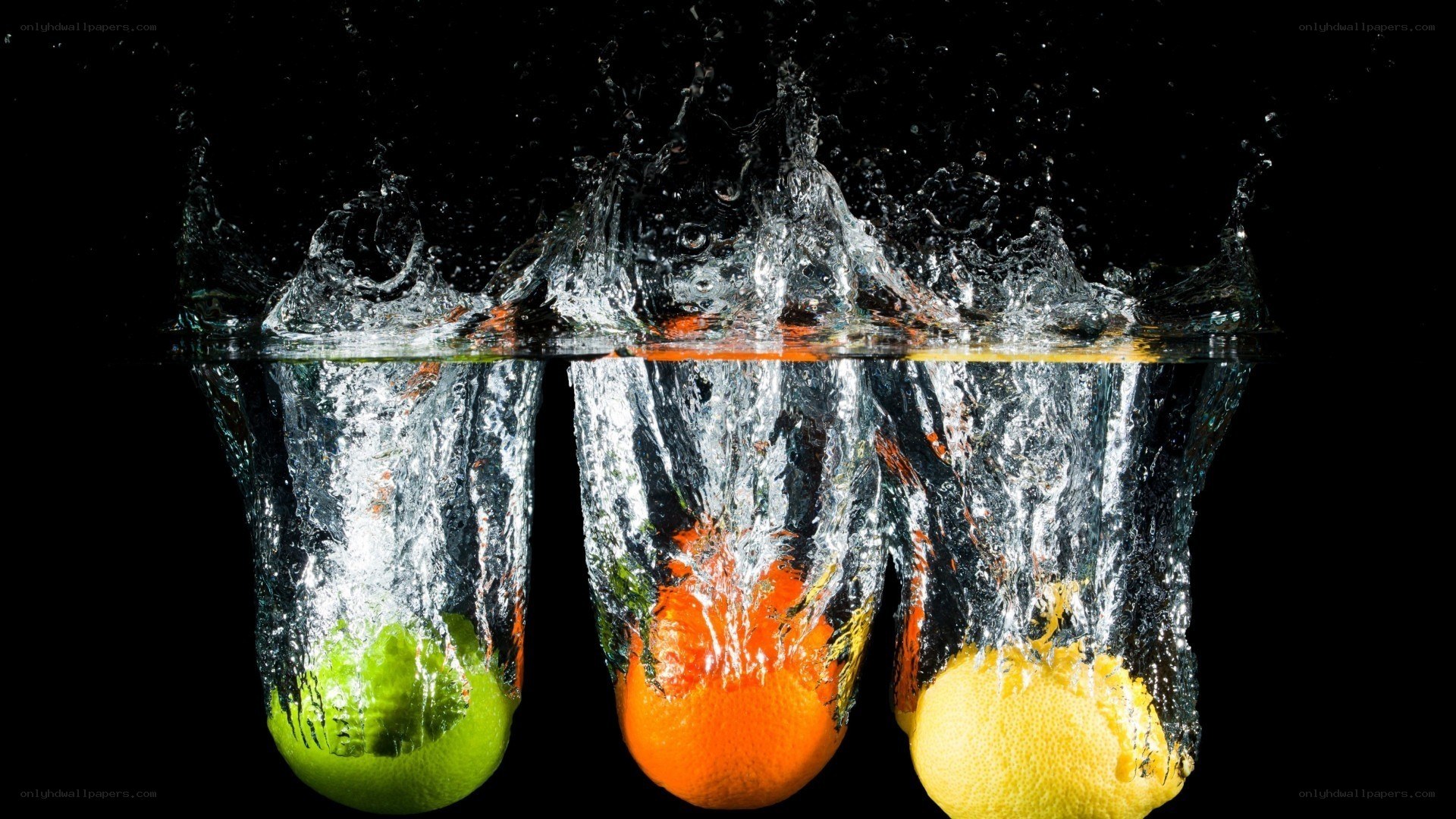 fruits splashing in water