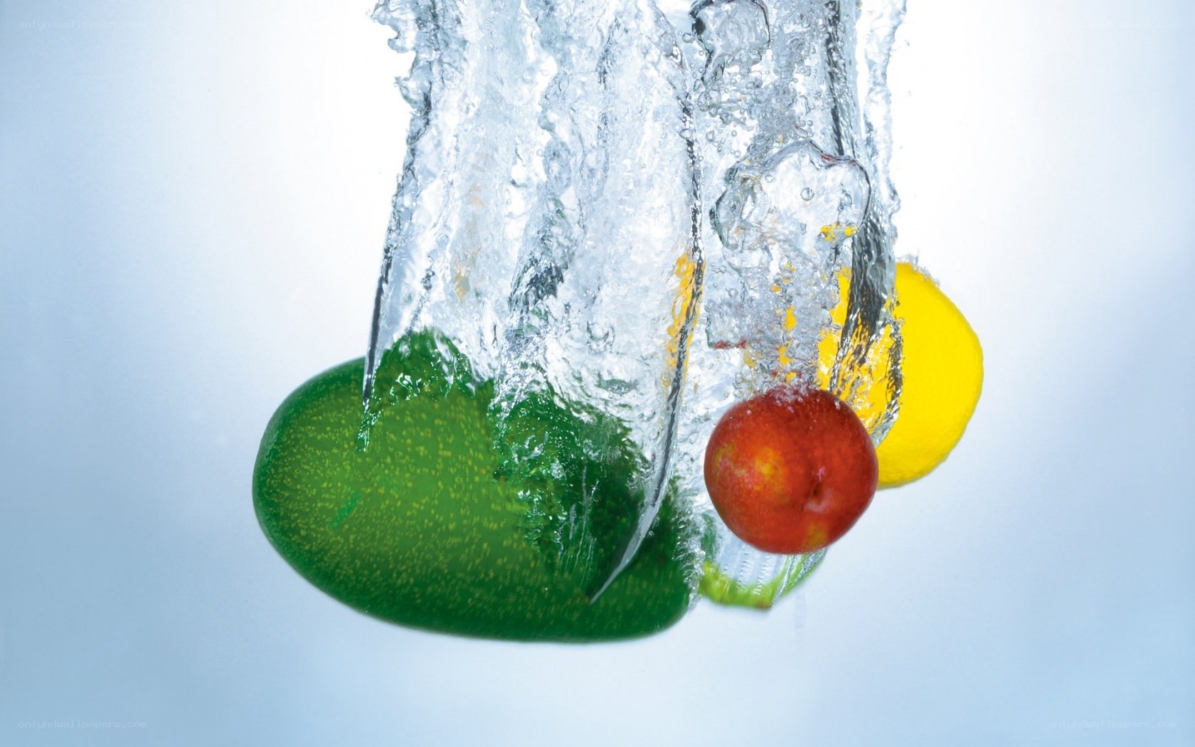 fruits splashing in water