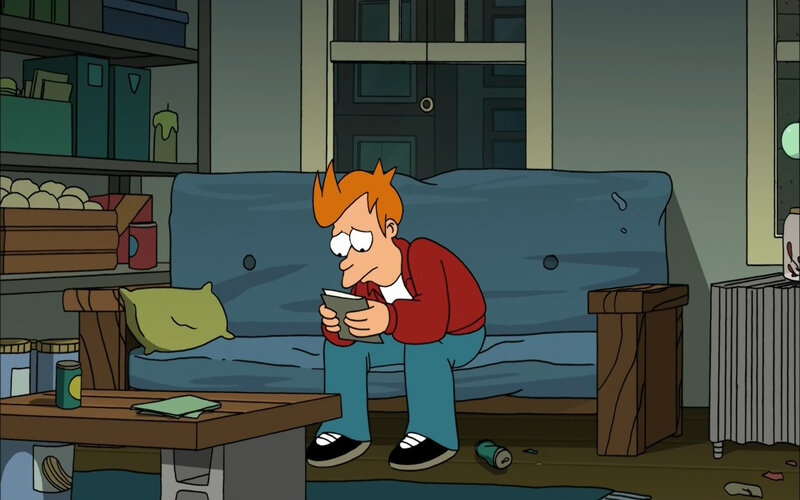 Fry reading on a couch