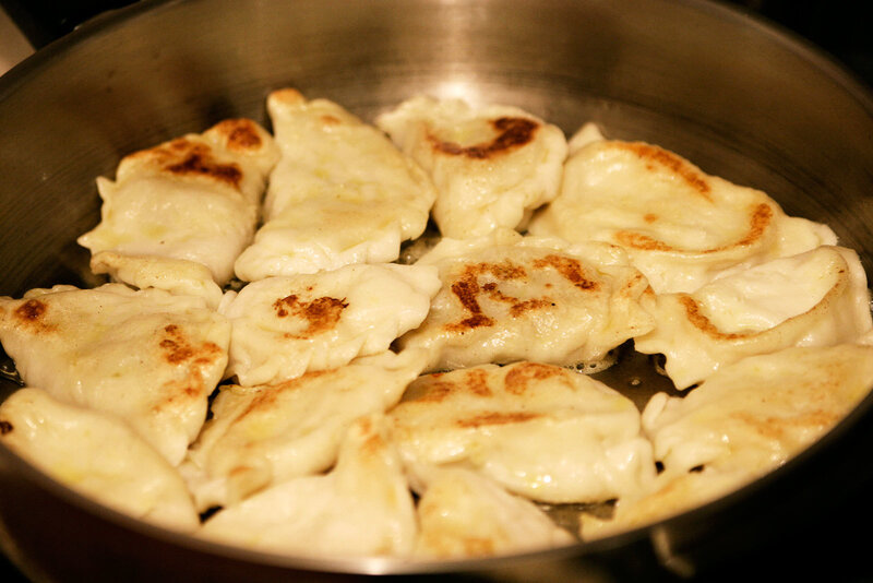 Frying dumplings in a pan