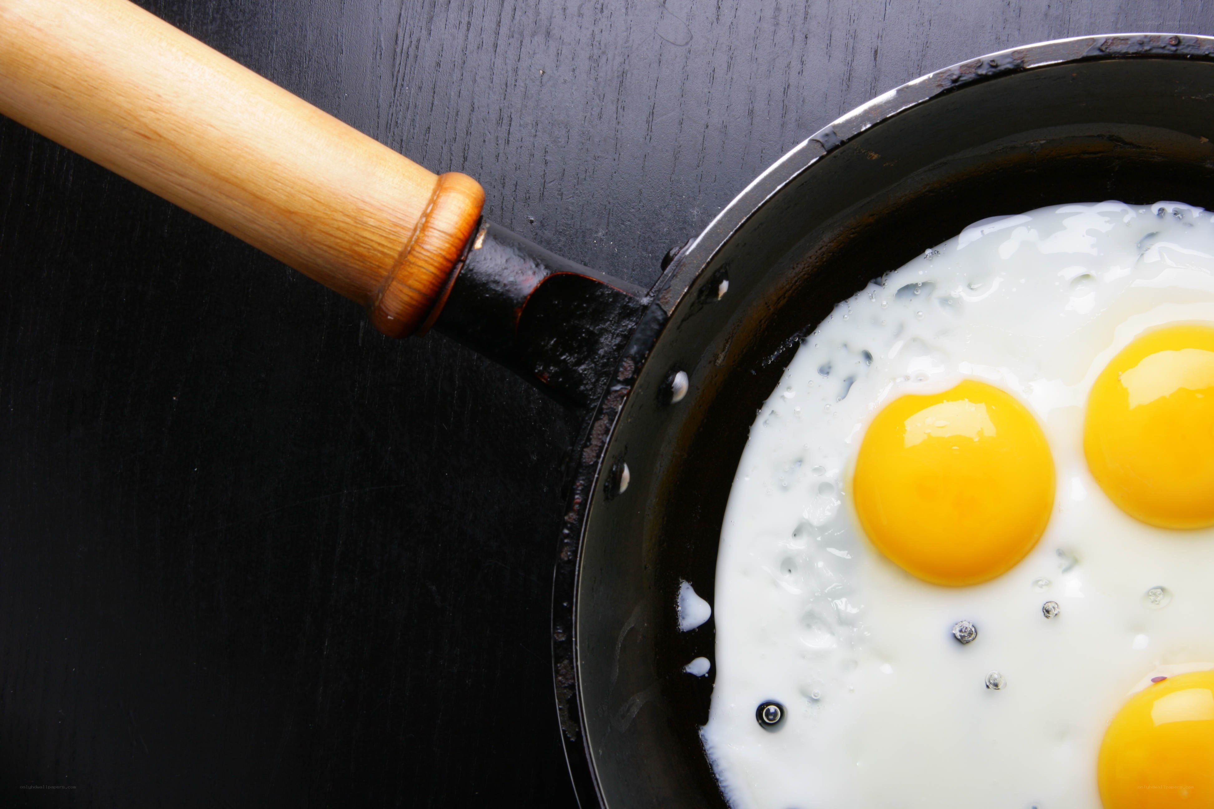frying eggs in a pan