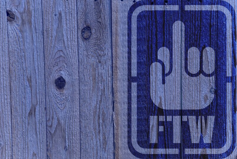 FTW hand gesture on wood